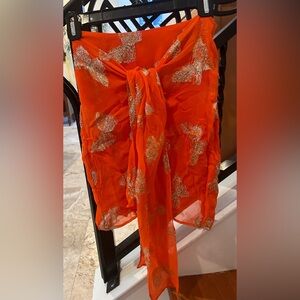 Happy orange with gold sparkles sexy  mini skirt with tie around front.